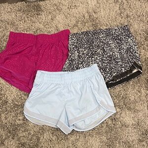 Set of 3 Athleta Mesh Racer Run Shorts 4” - Pink, Black and White, Light Blue